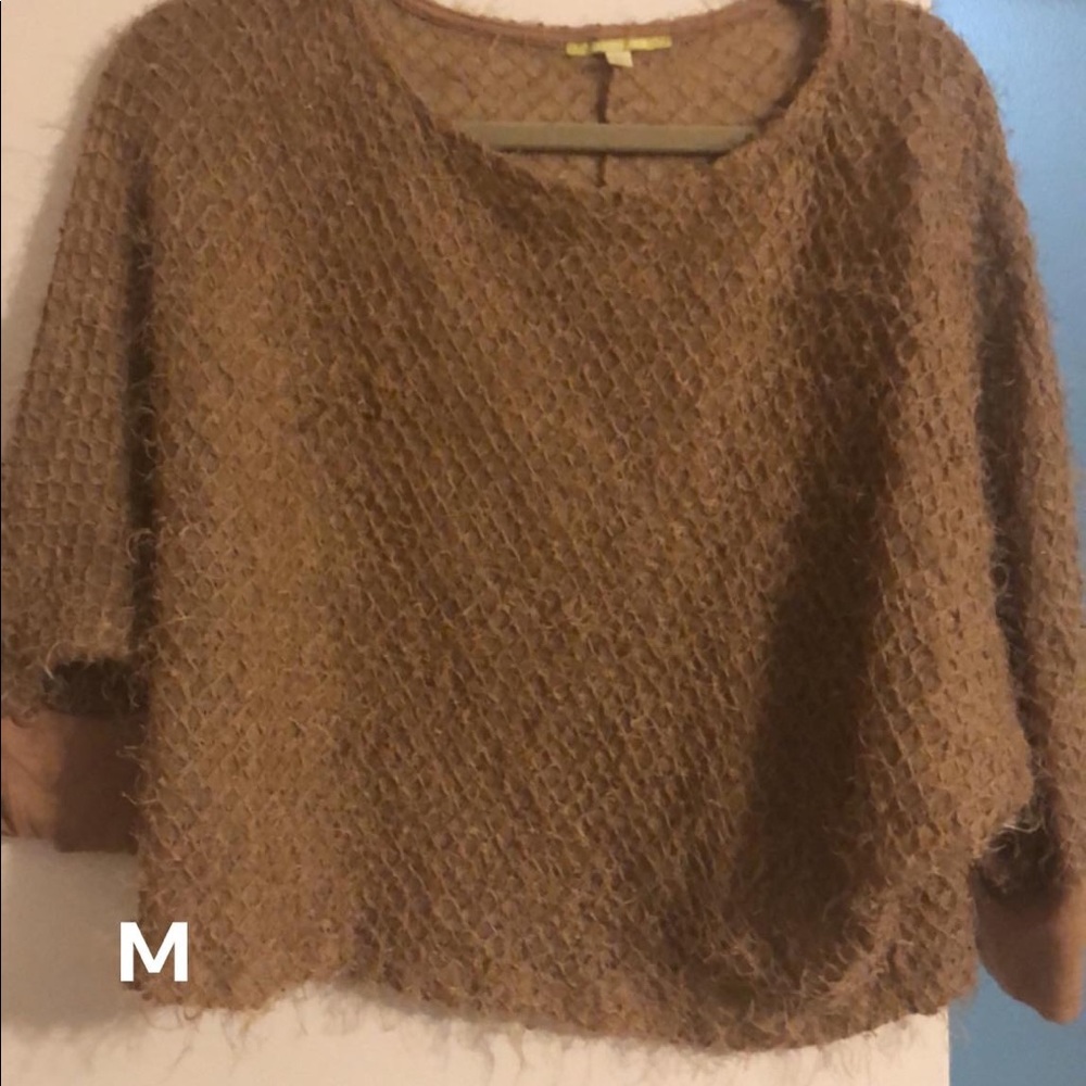 Sheer, short sleeve women’s shirt.